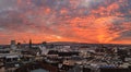 Burning sunset over the Swiss old city Basel in the dusk viewed high above on the Munster tower Royalty Free Stock Photo