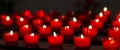 Burning tea lights in a small chapel Royalty Free Stock Photo