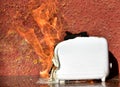 Burning toaster. Toaster with toast caught on fire over table