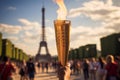 Burning torch in a hand of athlete as a symbol of the Olympic Games in Paris, France, Eiffel tower on background. Olympic games Royalty Free Stock Photo