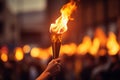 Burning torch in a hand of athlete as a symbol of the Olympic Games in Paris, France. Olympic games 2024 flame in Paris Royalty Free Stock Photo