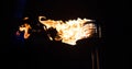 Burning Torch in the Night at black background Royalty Free Stock Photo