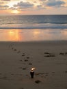 Burning torch on romantic sunset beach Royalty Free Stock Photo