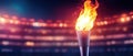 Burning Torch in a Stadium with Dramatic Lighting Royalty Free Stock Photo