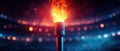 Burning Torch in a Stadium with Dramatic Lighting Royalty Free Stock Photo