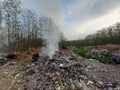 Burning trash in landfills