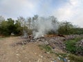 Burning trash in landfills Royalty Free Stock Photo