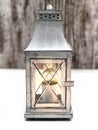 Burning vintage lamp on a gray-white background. Royalty Free Stock Photo