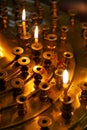 Burning warm candles at a ceremony in the temple.