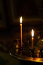 Burning warm candles at a ceremony in the temple