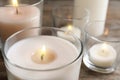 Burning wax candle in glass holder Royalty Free Stock Photo
