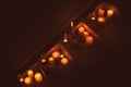Burning wax candles on stairs in darkness Royalty Free Stock Photo