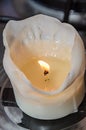 Burning white candle, melted wax, close up flame Royalty Free Stock Photo