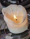 Burning white candle, melted wax, close up flame Royalty Free Stock Photo