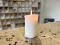 burning white candle, midium size