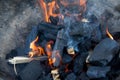 Burning wood coals for grill