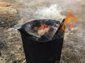 Burning wood fire in oil barrel Royalty Free Stock Photo