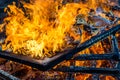 Burning wood, flame and smoke on blue background Royalty Free Stock Photo