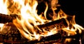 Burning wood, flames in the night with sparks Royalty Free Stock Photo