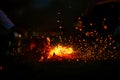 Burning wood at night. Campfire at nature in mountains. Flame and fire sparks. abstract background Royalty Free Stock Photo