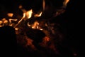 Burning wood at night. Campfire at touristic camp at nature in mountains. Flame amd fire sparks on dark abstract Royalty Free Stock Photo