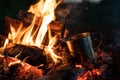 Burning wood at night. Campfire at touristic camp at nature in mountains. Flame amd fire sparks on dark abstract Royalty Free Stock Photo