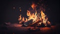 Burning wood at night. Campfire at touristic camp at nature in mountains. Flame amd fire sparks on dark abstract background Royalty Free Stock Photo