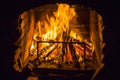 Burning wood in open fire place. Red flames in the fireplace