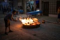 Burning wood on street bonfire for Sao Pedro festival in Povoa de Varzim, Portugal