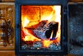 Burning wood to create heat. Heating the home with stove. Soba, incalzire iarna. Royalty Free Stock Photo