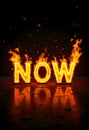 Burning word now on fire with sparks Royalty Free Stock Photo