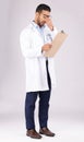 Burnout, clipboard and man doctor in a studio for a medical diagnosis or wellness treatment. Stress, headache and male Royalty Free Stock Photo