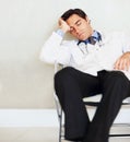 Burnout, fatigue and sleeping doctor, man or surgeon rest after medical cardiology, wellness services or exhausted. Eyes