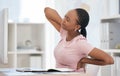 Burnout, stress and tired black woman with back pain in the office due to bad posture and uncomfortable chair. Fatigue Royalty Free Stock Photo