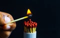 Burnout syndrome, stress, exhaustion and work-life balance concept. Close-up of a single burnt match in a group of matches. One ma Royalty Free Stock Photo