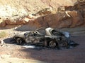 Burnt and abandoned car in a desert canyon near Las Vegas, Nevada. Royalty Free Stock Photo