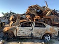 Burnt and blown up car. Traces of shots on the body of the car. Cars damaged after shelling. War between Russia and Ukraine, Kyiv