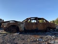 Burnt and blown up car. Traces of shots on the body of the car. Cars damaged after shelling. War between Russia and Ukraine, Kyiv