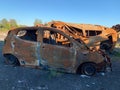 Burnt and blown up car. Traces of shots on the body of the car. Cars damaged after shelling. War between Russia and Ukraine, Kyiv