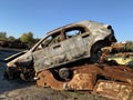 Burnt and blown up car. Traces of shots on the body of the car. Cars damaged after shelling. War between Russia and Ukraine, Kyiv