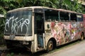 Burnt Bus wrackage parked on side the street photo taken in Jakarta Indonesia