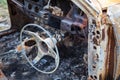 Burnt car interior with steering wheel after the accident Royalty Free Stock Photo