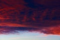 Burnt dark dramatic hurricane clouds in the sky in windy weather after sunset. Background with copy space Royalty Free Stock Photo