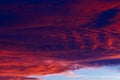 Burnt dark dramatic hurricane clouds in the sky in windy weather after sunset. Background with copy space Royalty Free Stock Photo