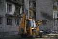 A burnt, destroyed apartment building without windows, damaged during shelling and military operations in Ukraine.