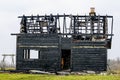 Burnt down two storey wooden house in rural area Royalty Free Stock Photo