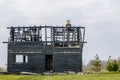 Burnt down two storey wooden house in rural area Royalty Free Stock Photo