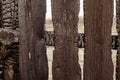 Burnt fence boards after a fire in a private house.