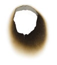 Burnt hole in a piece of paper Royalty Free Stock Photo
