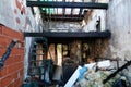 Burnt home room interior with walls house furniture and floor in ash and coal ruined old building after fire Royalty Free Stock Photo